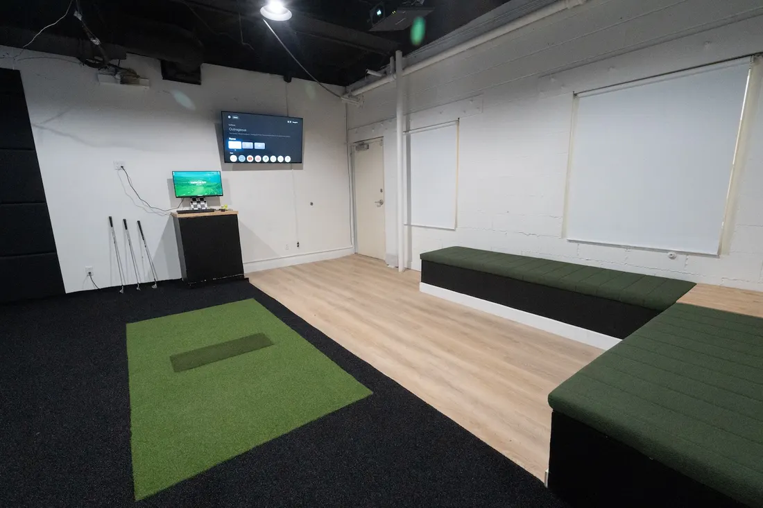 Simulator bay with seating for a group